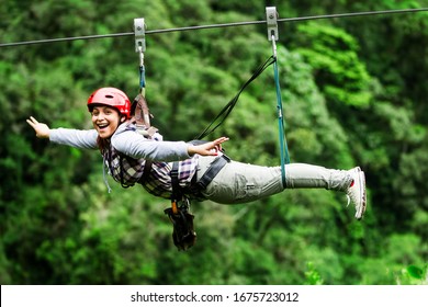 mature visitor wearing informal suit on zipline trip selective stress against misty jungle excursion race zipline canopi vacation vegetation canopy outdoor expedition feminine rainforest ecuador fores - Shutterstock ID 1675723012