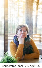 Mature Woman 60s Years Old Is Lunching With Coffee In Cafe.