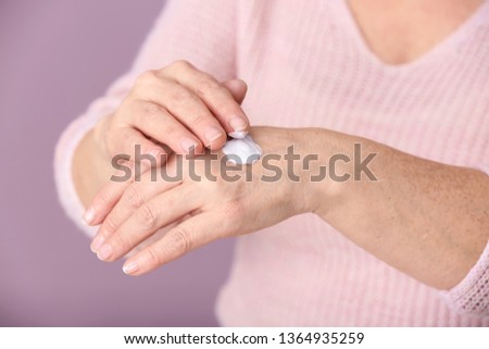 Similar – Image, Stock Photo Hand of a mature woman holding a cup of coffee.