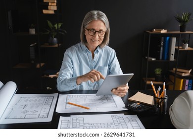 Mature woman, architect and blueprint with tablet, planning and design for vision or project. Female person, professional and technology as designer or creative for management, company or development
