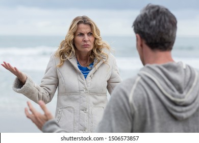 Mature woman arguing with man on the beach - Powered by Shutterstock