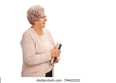 Mature Woman With A Book Smiling Isolated On White Background