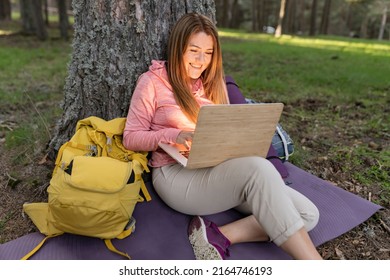 Mature Woman Camping In Nature Teleworking With Laptop Computer