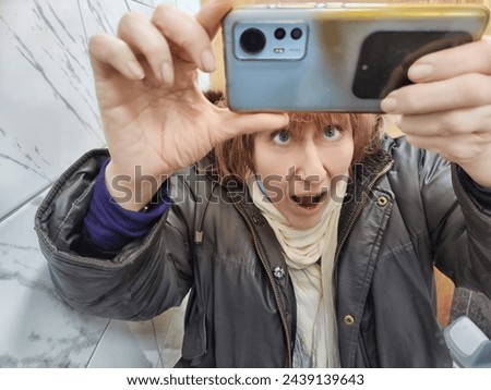 Image, Stock Photo funny twin sisters make a selfie with the smartphone