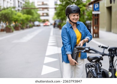 Mature woman changing battery on electric bicycle
 - Powered by Shutterstock