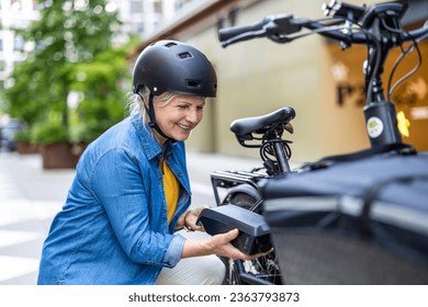 Mature woman changing battery on electric bicycle
 - Powered by Shutterstock