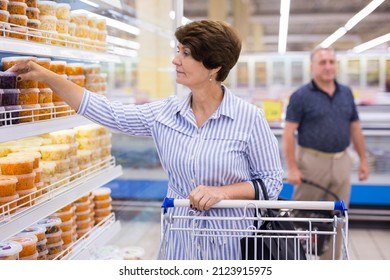 Mature Woman Considering Sauerkraut Cabbage And Pickles