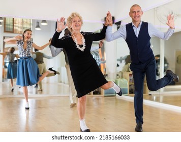 Mature Woman Dancing Swing With Young Man