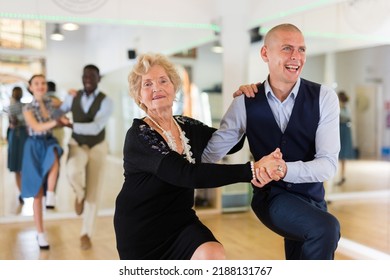 Mature Woman Dancing Swing With Young Man