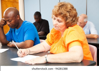 Mature Woman In Diverse Adult Education Class.