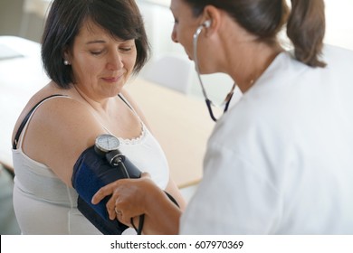 Mature Woman At The Doctor, Controlling Blood Pressure