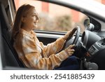 Mature woman driving car in city