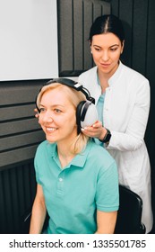 Mature Woman During Hearing Test At Audiologist Office