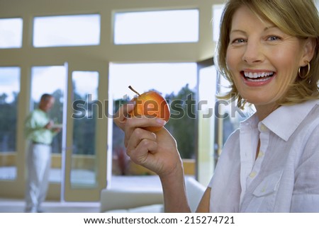 A hungry woman looks in the fridge