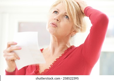 Mature Woman Experiencing Hot Flush From Menopause