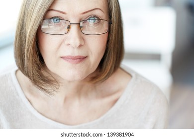 Mature Woman In Eyeglasses Looking At Camera