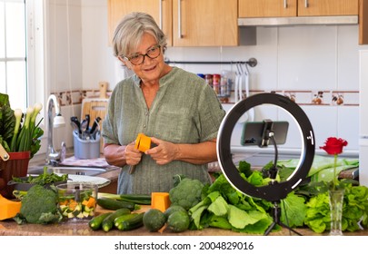 Mature Woman Following Online Cooking Lesson, Blogger, Video - Vegetarian Vegan Diet