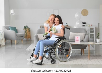 Mature woman greeting her daughter in wheelchair for International Women's Day at home - Powered by Shutterstock