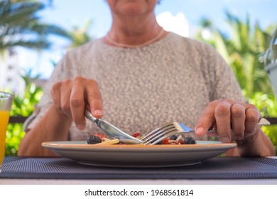 Mature Woman With Healthy Summer Breakfast, Classic American Pancakes With Banana, Kiwi, Fresh Berry And Honey