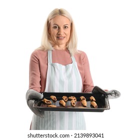 Mature Woman Holding Baking Dish With Tasty Cookies On White Background