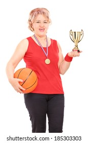 Mature Woman Holding Trophy And A Basketball Isolated On White Background