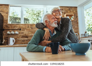 Mature woman hugging her husband - Shutterstock ID 1194118255