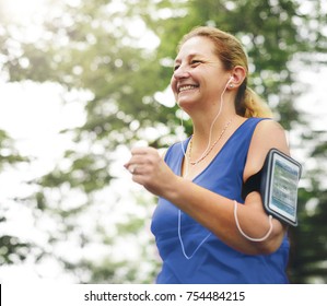 Mature Woman Jogging In The Park