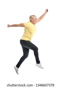 Mature Woman Jumping Against White Background