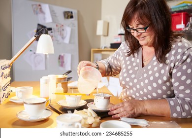 Mature Woman Making Candles At Home