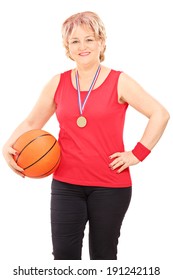 Mature Woman With A Medal Holding Basketball Isolated On White Background