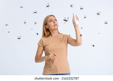 Mature Woman With Mosquito Repellent On Light Background