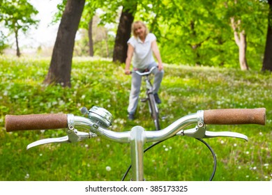 Mature Woman Mountain Biking Outside