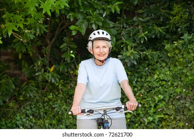 Mature Woman Mountain Biking Outside