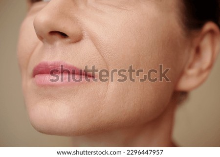 Mature woman with nasolabial folds, selective focus