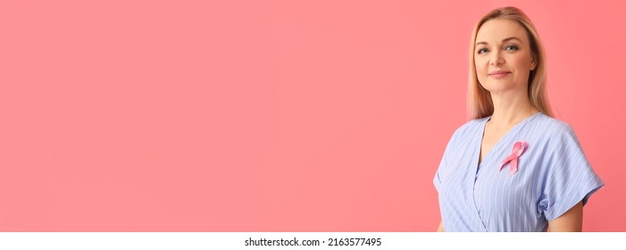 Mature woman with pink ribbon on color background with space for text. Breast cancer awareness concept - Shutterstock ID 2163577495