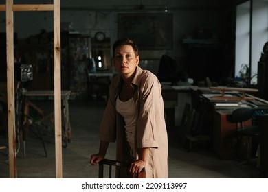 A Mature Woman Poses In A Film Studio.