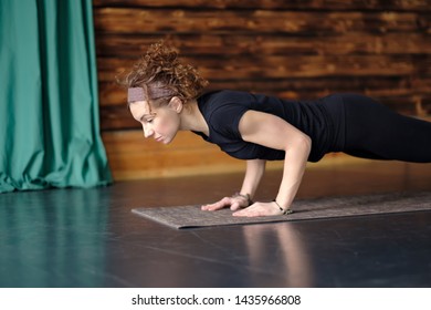 Mature Woman Practicing Yoga, Doing Push Ups, Press Ups, Chaturanga Dandasana Pose, Working Out