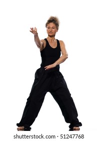 Mature Woman Praticing Tai Chi Chuan In Studio On Isolated White Background