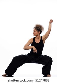 Mature Woman Praticing Tai Chi Chuan In Studio On Isolated White Background