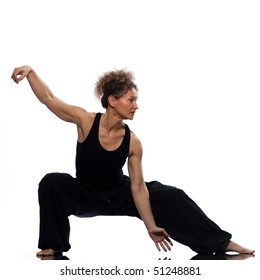 Mature Woman Praticing Tai Chi Chuan In Studio On Isolated White Background