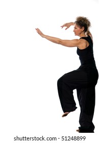 Mature Woman Praticing Tai Chi Chuan In Studio On Isolated White Background