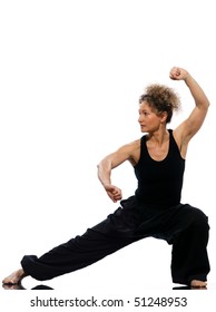 Mature Woman Praticing Tai Chi Chuan In Studio On Isolated White Background