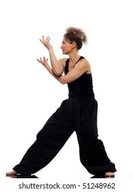 Mature Woman Praticing Tai Chi Chuan In Studio On Isolated White Background