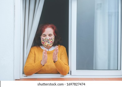 Mature Woman With Protective Mask Clapping At The Window