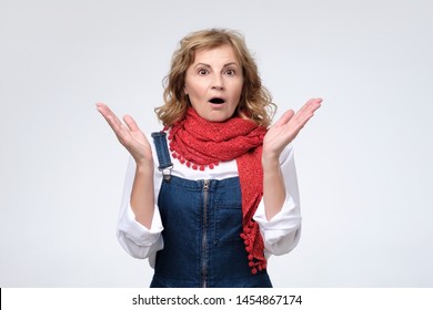 Mature Woman Pulling Being Shocked With News. Studio Shot