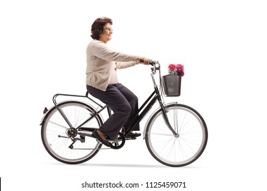 Mature Woman Riding A Bicycle Isolated On White Background