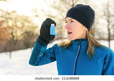 A Mature Woman Running At Winter In Park Have Some Breathing Difficulties And Using Asthma Pump