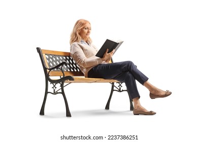 Mature woman sitting on a bench and reading a book isolated on white background