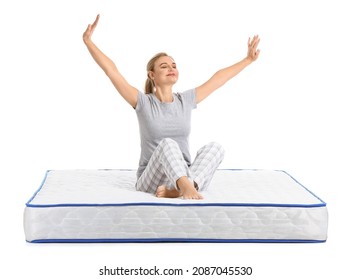 Mature woman sitting on soft mattress against white background - Powered by Shutterstock