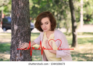 Mature Woman Suffering From Heart Attack Outdoors